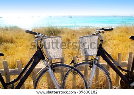 bicycles couple parked in Formentera beach of Illetes