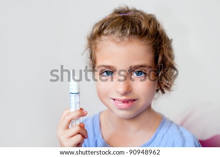 almost happy children kid girl with syringe of antibiotic medicine