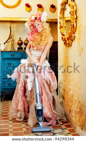 stock photo baroque fashion blonde housewife woman at vacuum cleaner 