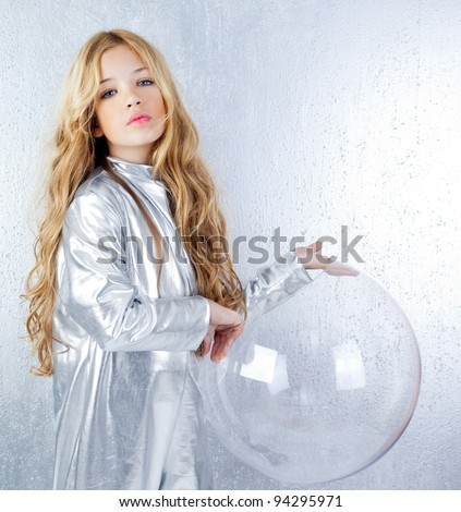 Astronaut futuristic kid girl with silver uniform and glass helmet