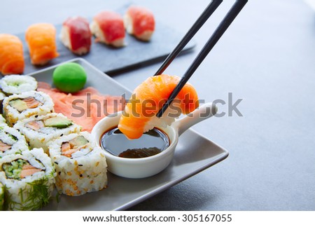 Sushi Maki and Niguiri with soy sauce and wasabi with California Roll