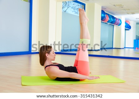 Pilates woman hundred exercise workout at gym indoor