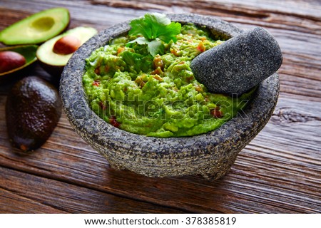 avocado Guacamole on molcajete real Mexican traditional procedure
