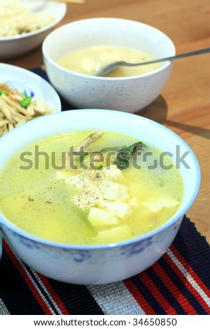 Tofu and fish soup.Chinese traditional soup cooked with tofu and fish