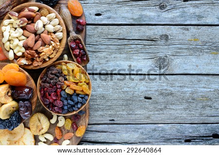 Mix of dried fruits and nuts - symbols of judaic holiday Tu Bishvat. Copyspace background.