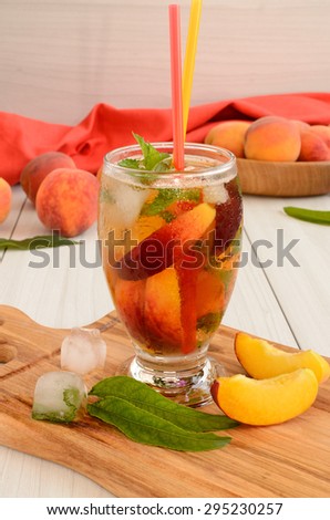 Summer drink with apricot ( or peach) in glass, selective focus