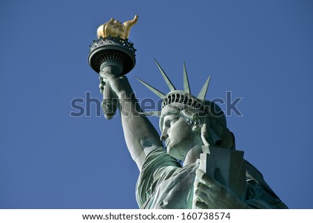 Statue of Liberty on Hudson River in NYC.