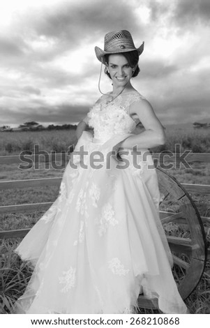 Country girl bride  on ranch in black and white.