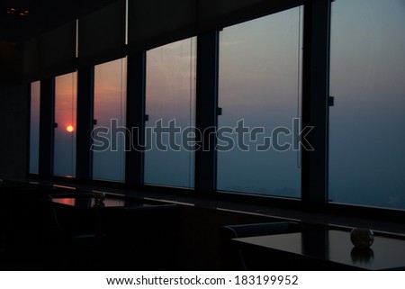 look through a window and sunset
