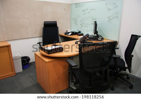Corporate office settings showing desks, cubicles, files, and conference space