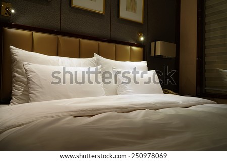 Night scene in hotel room, nightstand with lamp