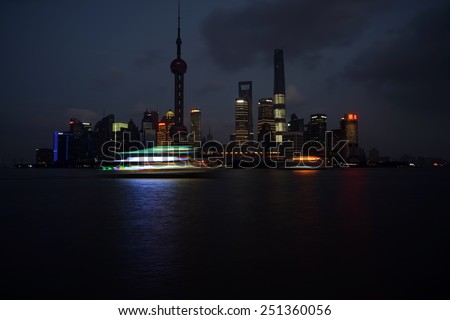 SHANGHAI, CHINA - February 6, 2015: New Shanghai skyline with the Oriental Pearl Tower, Shanghai World Financial Center, Jin Mao Tower and Shanghai Tower on February 6, 2015 in Shanghai.