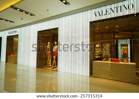 SHANGHAI, CHINA - March 2. 2015: Interior of the new IAPM Shopping Mall downtown in old French Concession. Valentino brand store inside Just after Chinese new year at March 2. 2015 Shanghai, China