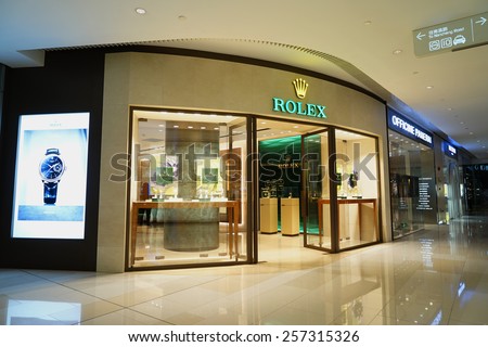 SHANGHAI, CHINA - March 2. 2015: Rolex brand store and Interior of the new IAPM Shopping Mall downtown in old French Concession. Just after Chinese new year at March 2. 2015 Shanghai, China