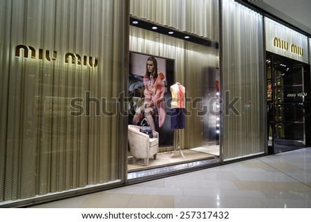 SHANGHAI, CHINA - March 2. 2015: Interior of the new IAPM Shopping Mall downtown in old French Concession. MIUMIU brand store inside Before Chinese new year at March 2. 2015 Shanghai, China