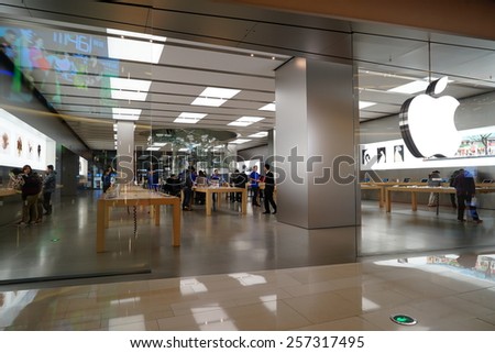 SHANGHAI, CHINA - March 2. 2015: Interior of the new IAPM Shopping Mall downtown in old French Concession. Apple store inside Before Chinese new year at March 2. 2015 Shanghai, China