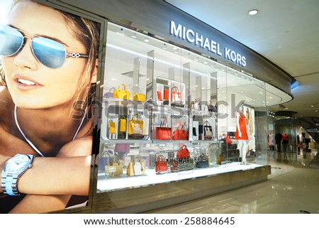 SHANGHAI, CHINA - March 8. 2015: Interior of the IFC Shopping Mall downtown in Pudong Lujiazui. Michael Kors brand store inside Just The international women\'s day at March 8. 2015 Shanghai, China