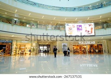 SHANGHAI-APR. 5, 2015. Luxury shopping mall interior. China accounts for about 20 percent, or 180 billion renminbi ($27 billion ) of global luxury sales in 2015, according to new McKinsey research.