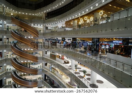 SHANGHAI-APR. 5, 2015. Luxury shopping mall interior. China accounts for about 20 percent, or 180 billion renminbi ($27 billion ) of global luxury sales in 2015, according to new McKinsey research.