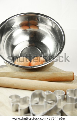 baking tin, bowls and other equipment on white background