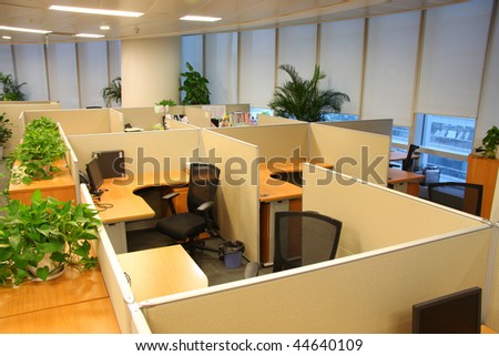 Corporate office settings showing desks, cubicles, files, and conference space