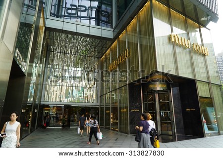 SHANGHAI, CHINA - Sept. 3, 2015: Miu Miu store at night. Miu Miu is Prada\'s secret weapon to win China\'s young luxury shoppers with its edgier image is propelling Prada\'s growth.