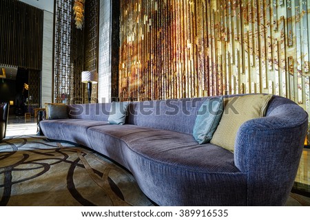 Luxury lobby interior.With crystal lamp,bing hall, marble floor, french sash,mosaic tile,comfortable sofa, reception desk and long Escalators.