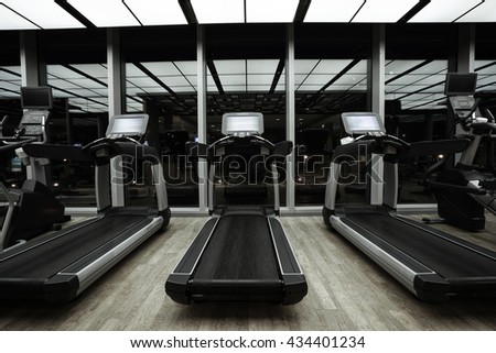 Fitness club in luxury hotel interior.