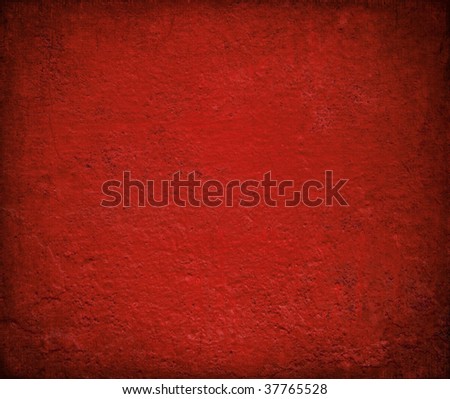 grungy red gloss painted wall with burned frame for christmas