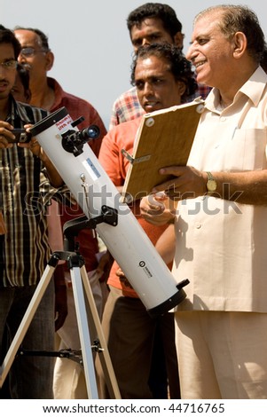 KERALA, INDIA - JANUARY 15: an astronomer demonstrates the projection method on the solar eclipse January 15, 2010 in Kerala, South India