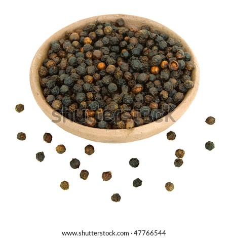 Black Peppercorns in a handmade clay bowl isolated with clipping path