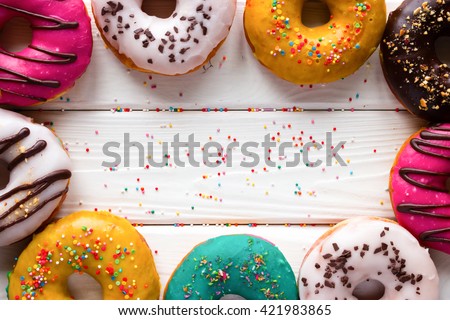 donuts on a wooden background and space for text