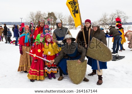 Nazarjevo village, Moscow area, Russian Federation - February 22, 2015: Maslenitsa is a traditional russian winter holiday. Wearing bright folk clothes is a popular entertainment.