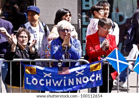NEW YORK - APRIL 14:  Three Ladies cheer on The Scotland Week Parade on 6th Avenue Avenue April 14, 2011 in New York, NY.