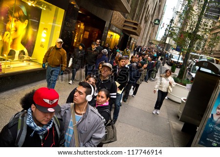 NEW YORK - NOVEMBER 2:  Commuters wait in long lines for Bus service around Grand Central post Hurricane Sandy November 2, 2012 in New York City.