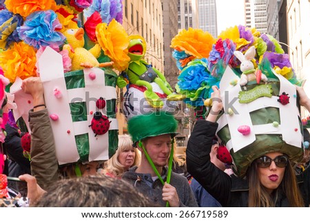 NEW YORK - APRIL 5:  A group of people with very large and creative easter bonnets pose for pictures during The 2015 Easter Parade