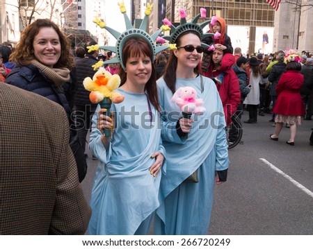 NEW YORK - APRIL 5:  Two woman dressed up as The Statue of Liberty during The 2015 Easter Parade and Easter Bonnet Festival in New York City