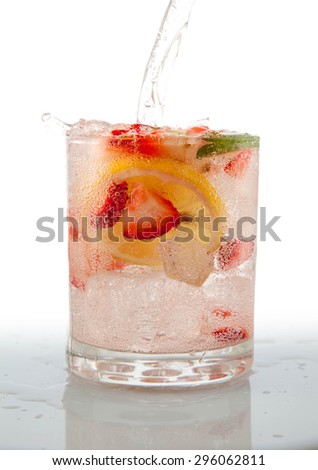 Seltzer Drink with Fresh cut fruit floating inside