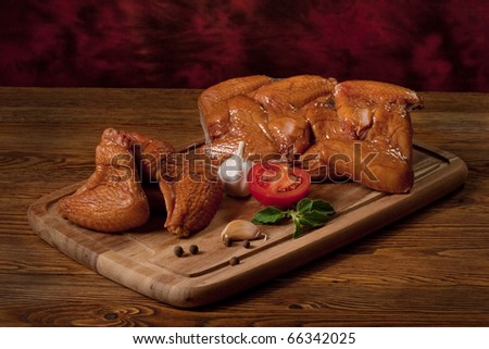 Composition with smoked chicken wings on the table