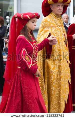 ALBA, ITALY-OCTOBER 7: Unidentified participants dressed in medieval clothes parade at the historical city during International Exhibition of truffles of Alba on October, 7.2012 in Alba, Italy.