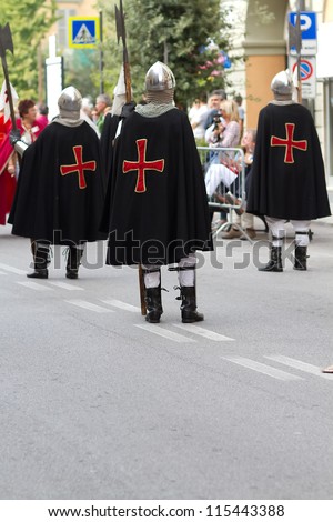 ALBA, ITALY-OCTOBER 7: Unidentified participants dressed in medieval clothes parade at the historical city during International Exhibition of truffles of Alba on October, 7.2012 in Alba, Italy.