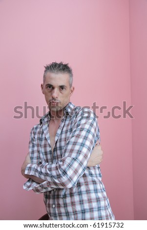 man in checkered shirt keeps your arms folded