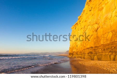 Sunset light on the cliffs of San Gregorio beach, California.