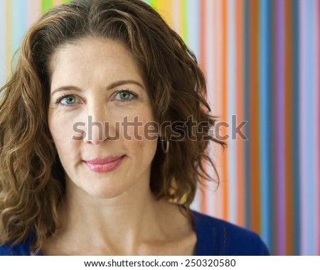 Average middle aged woman, smiling at the camera.
