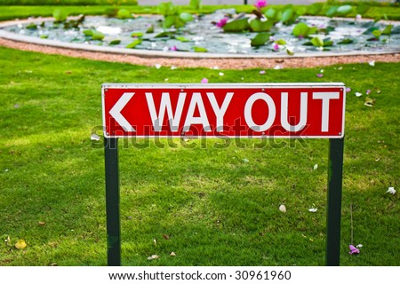 Way Out Sign on a Lawn in India