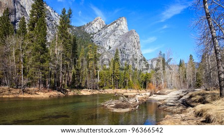 Panoramic view of the Merced River and the Three Brothers peak in Yosemite National Park, California.
