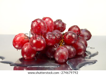 grapes in drops of water on the mirror surface