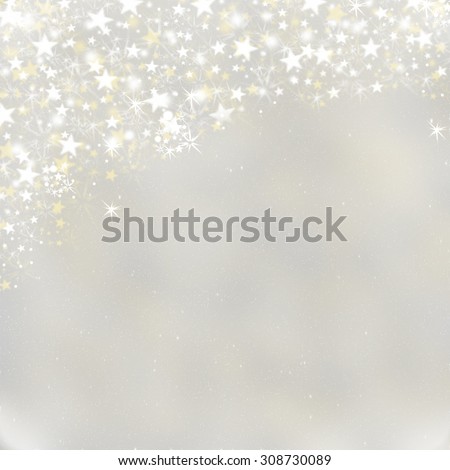 Magic Christmas lights sparkling snow background with stardust and shining stars. Gray grey winter Holiday postcard concept with space for text.