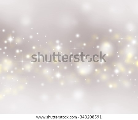 Magic Christmas lights sparkling snow background with stardust and shining stars. Gray grey winter Holiday postcard concept with space for text. Snowflakes and sparkles wallpaper with star dust.