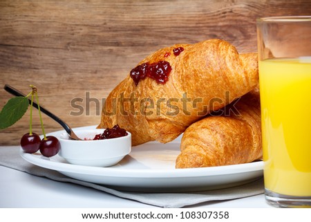 Breakfast with croissant and juice